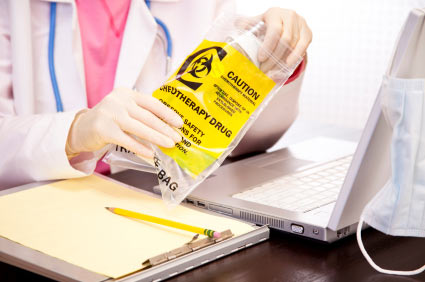 Doctor holding chemotherapy medication