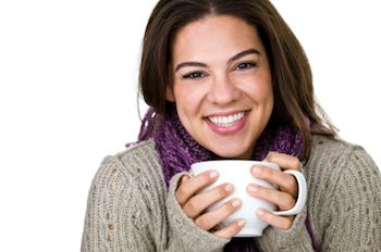 lady holding a cup of coffee