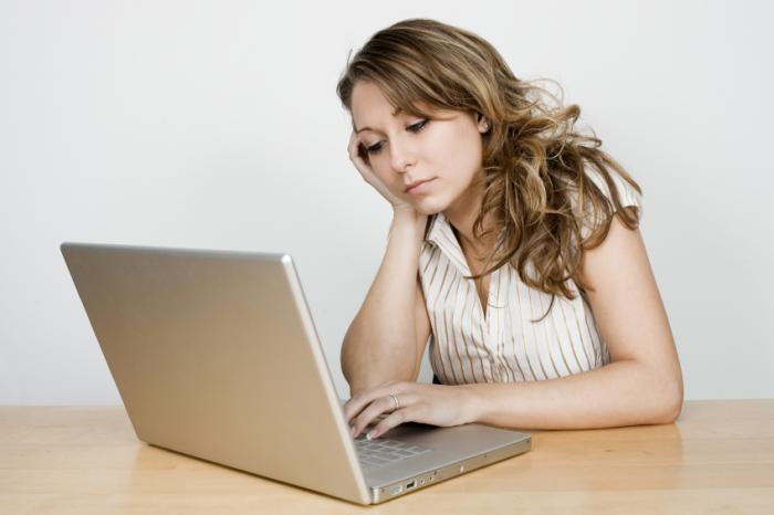 unhappy girl using computer