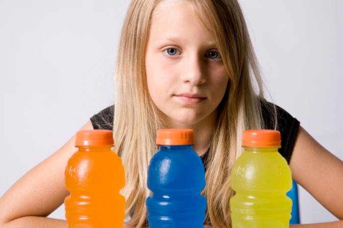 girl with a selection of sports drinks