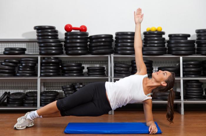 Woman performing the Side Plank yoga pose