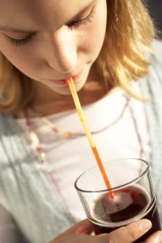 A girl drinking soda