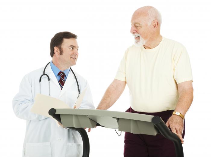 older man on treadmill and doctor