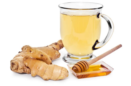 A glass mug of ginger tea