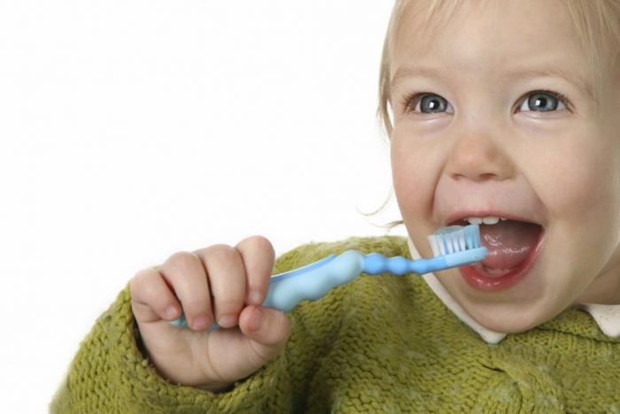 [Baby brushing his teeth ]